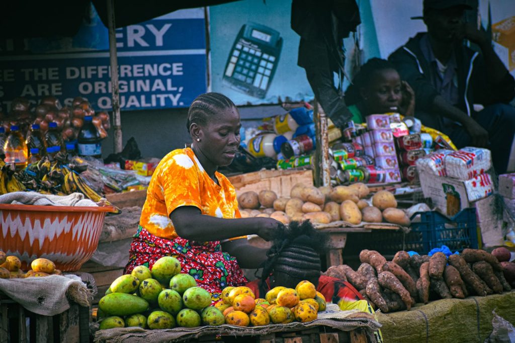 pexels-photo-28263405 Colorful bustling market scene in Monrovia with local vendors selling fresh produce and goods in Liberia.